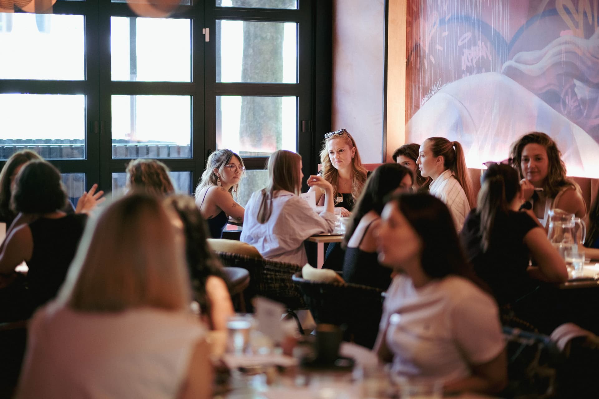 A full room of members at a networking session