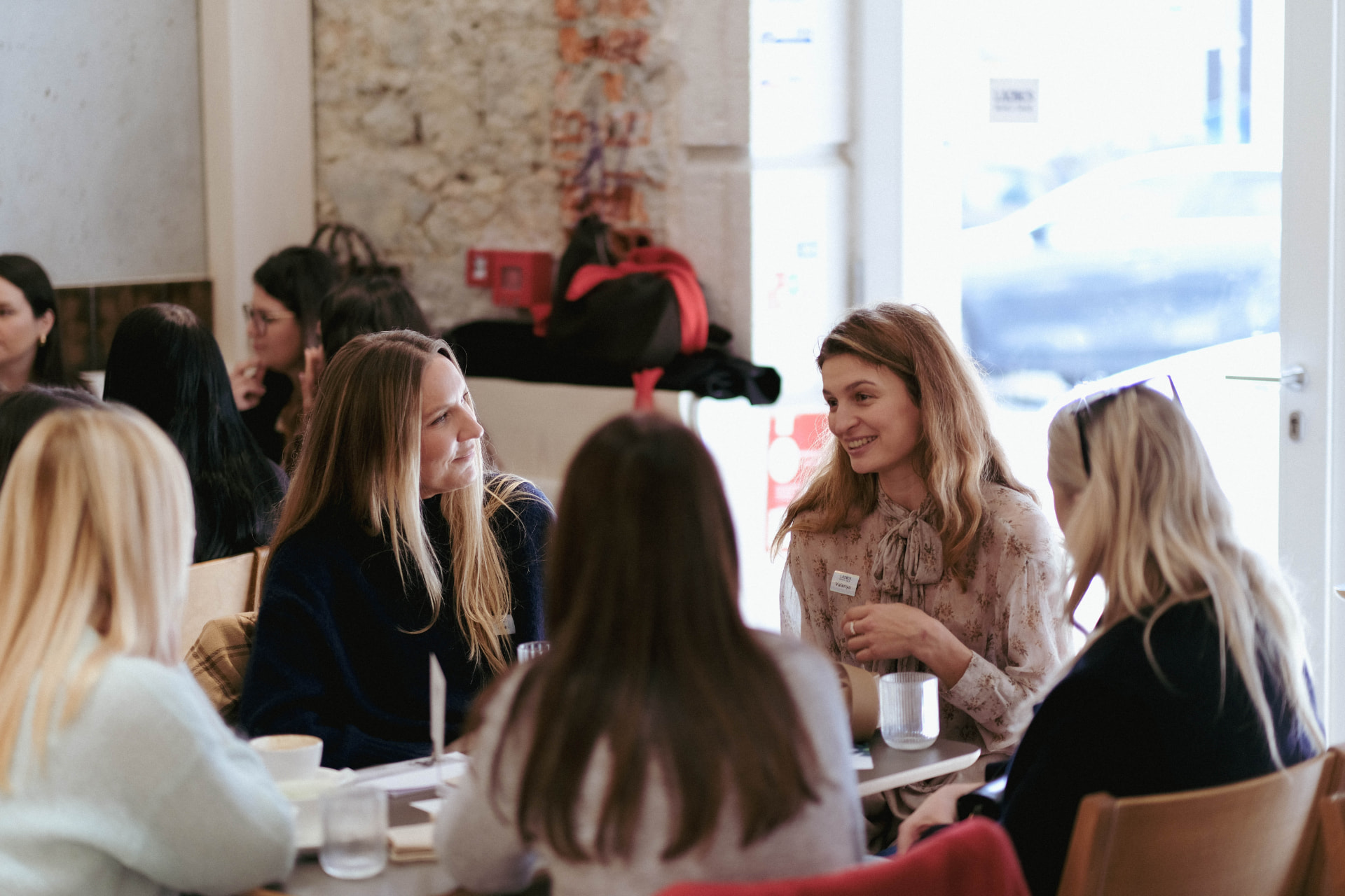 Members talking over coffee at a Ladies Who Talk breakfast